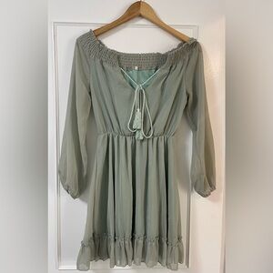 Super cute off the shoulder green mini dress. Long sleeve. Size small.